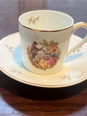 Limoges White Porcelain Cup and Saucer with Gold Trim and Pastoral Scene